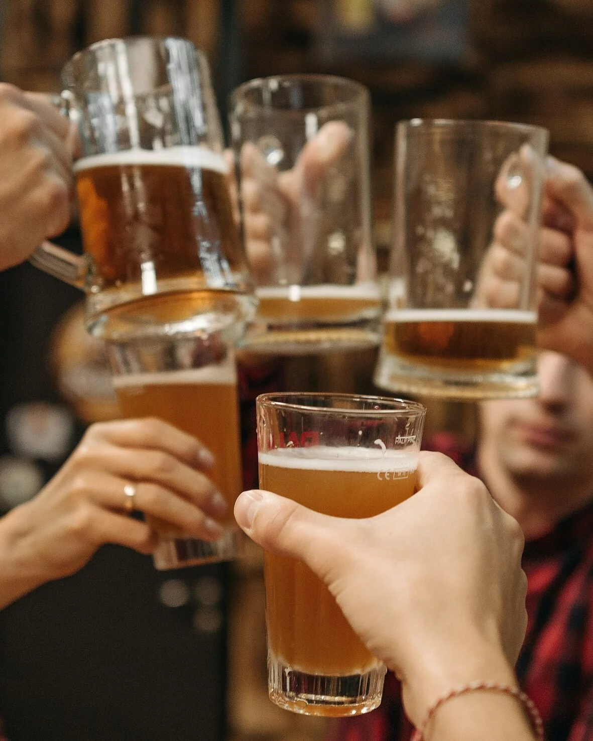 Group Of People Raising A Glass
